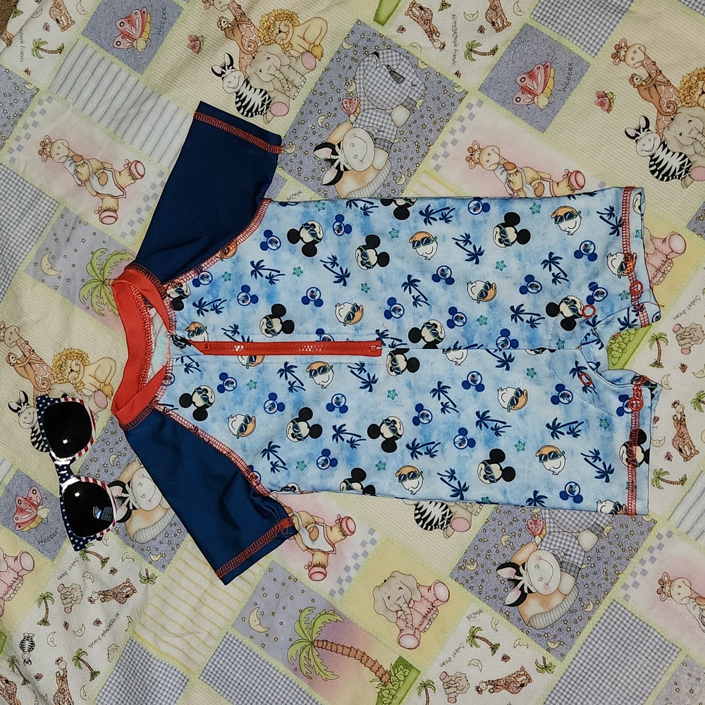 Disney Baby 6/9 Months short sleeve, half zip, snap bottoms swim suit.